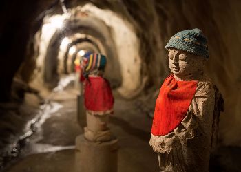 Kid like statues in a cave